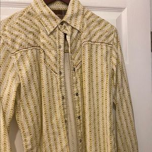 Vintage Red with a Western flare. Yellowish with brown stitching. Snap buttons